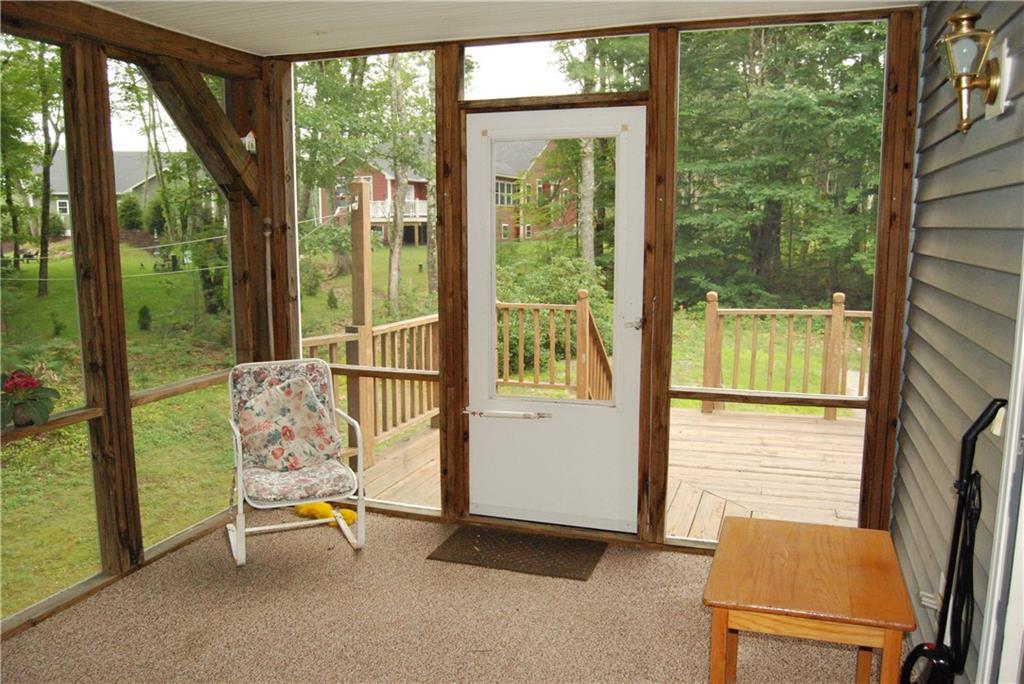 88 Loop Road Wells, ME 04090 - Photo 17 of 24 Screened porch looking onto large...