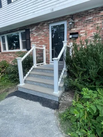 a view of a house with entrance and stairs