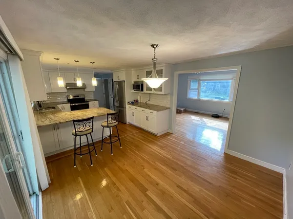 a kitchen with a sink appliances and cabinets