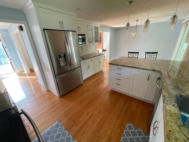 a kitchen with stainless steel appliances a refrigerator and a sink