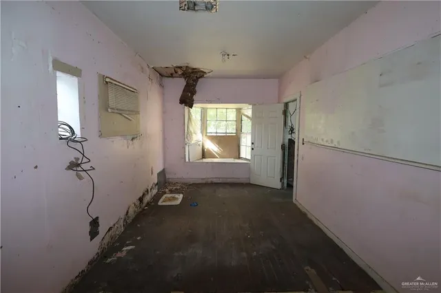 a view of empty room with windows