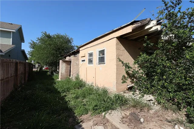 a backyard of a house with lots of green space
