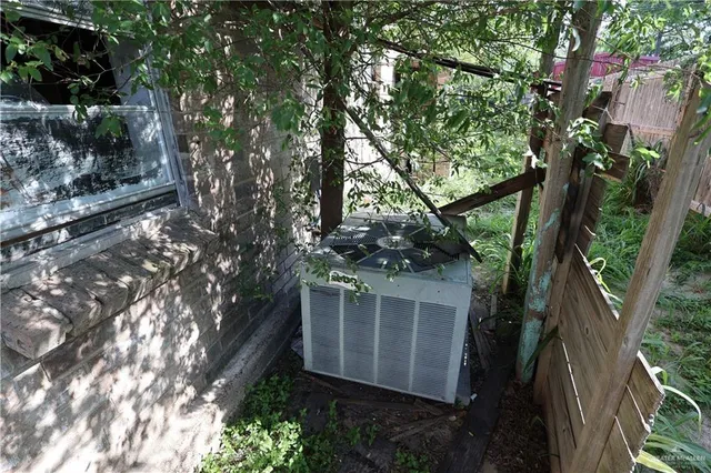 a view of a house with a tree