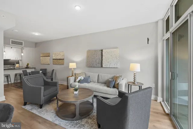 a living room with furniture and a lamp