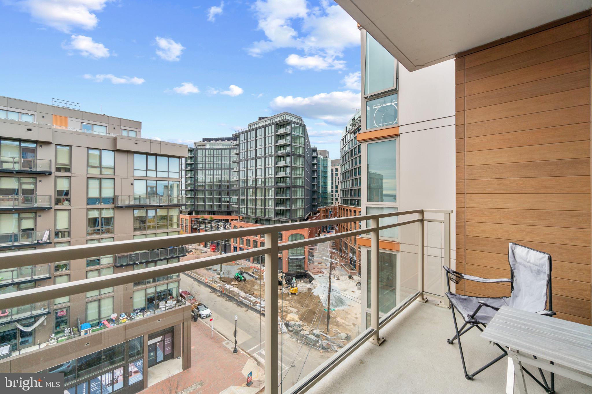 88 V Street Southwest, Unit 710 Washington, DC 20024 - Photo 5 of 31 a view of a balcony with chairs