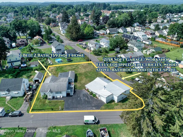 an aerial view of a house having swimming pool patio and lake view