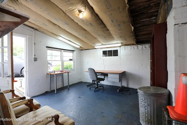 a workspace with furniture and a window