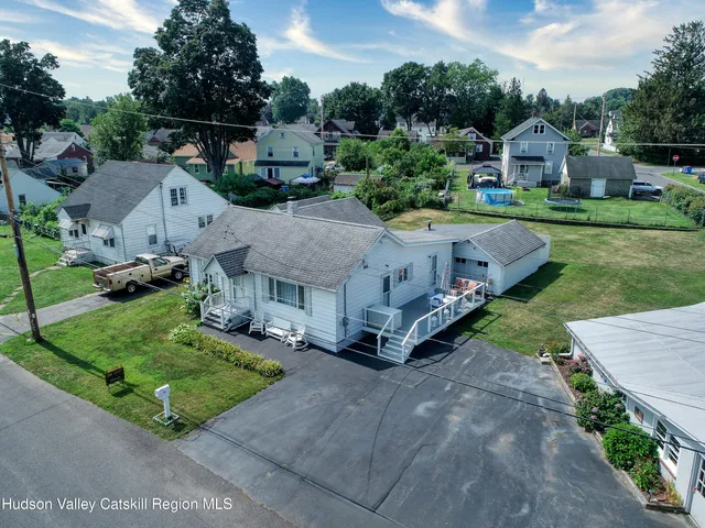 an aerial view of a house with a garden