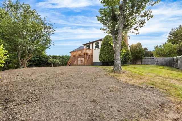 a backyard of a house with lots of green space