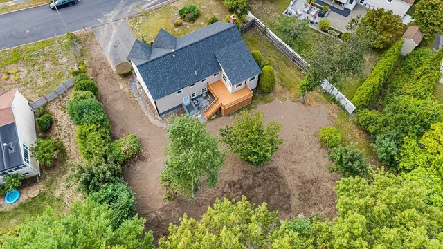 an aerial view of a house with a garden
