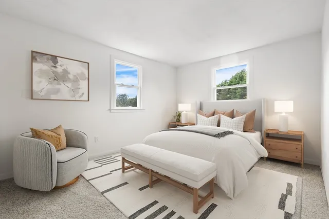 a bedroom with a bed and a couch