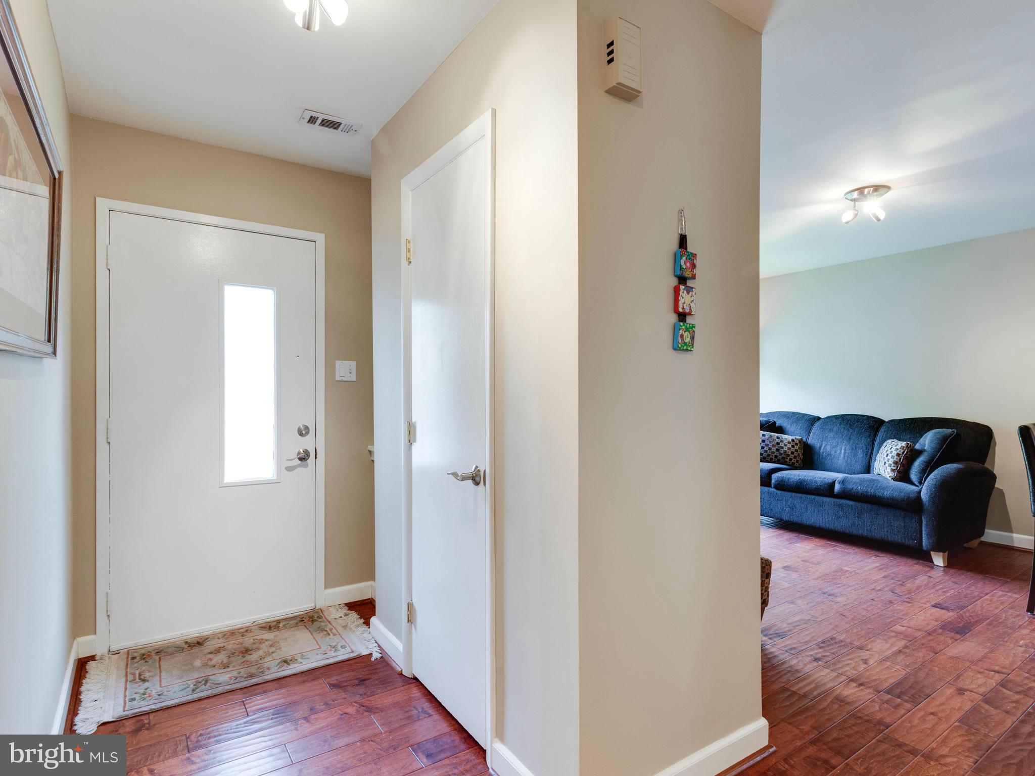 2357 Glade Bank Way Reston, VA 20191 - Photo 2 of 30 a view of a livingroom with furniture and wooden floor