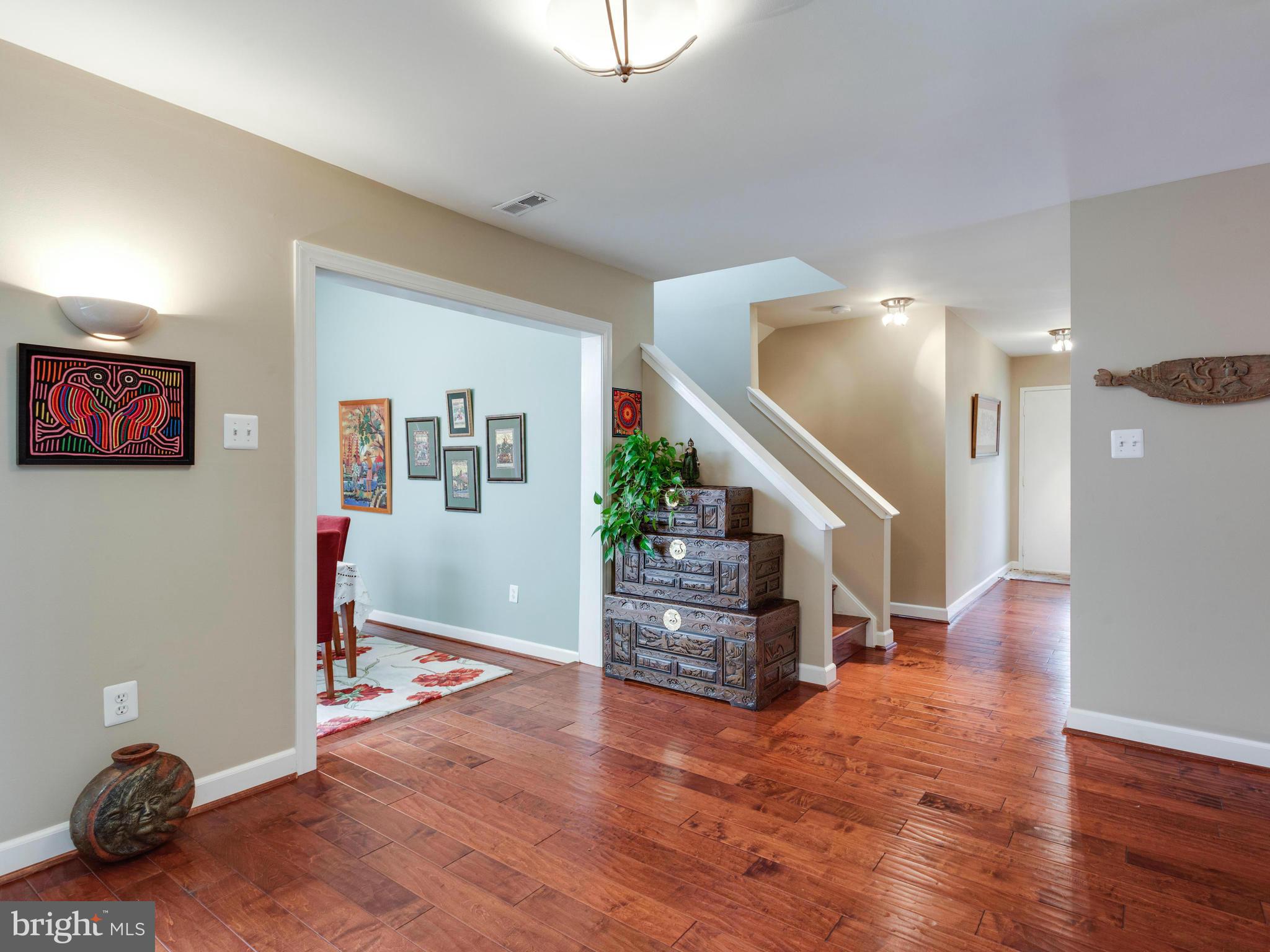 2357 Glade Bank Way Reston, VA 20191 - Photo 11 of 30 a view of entryway and livingroom with wooden floor