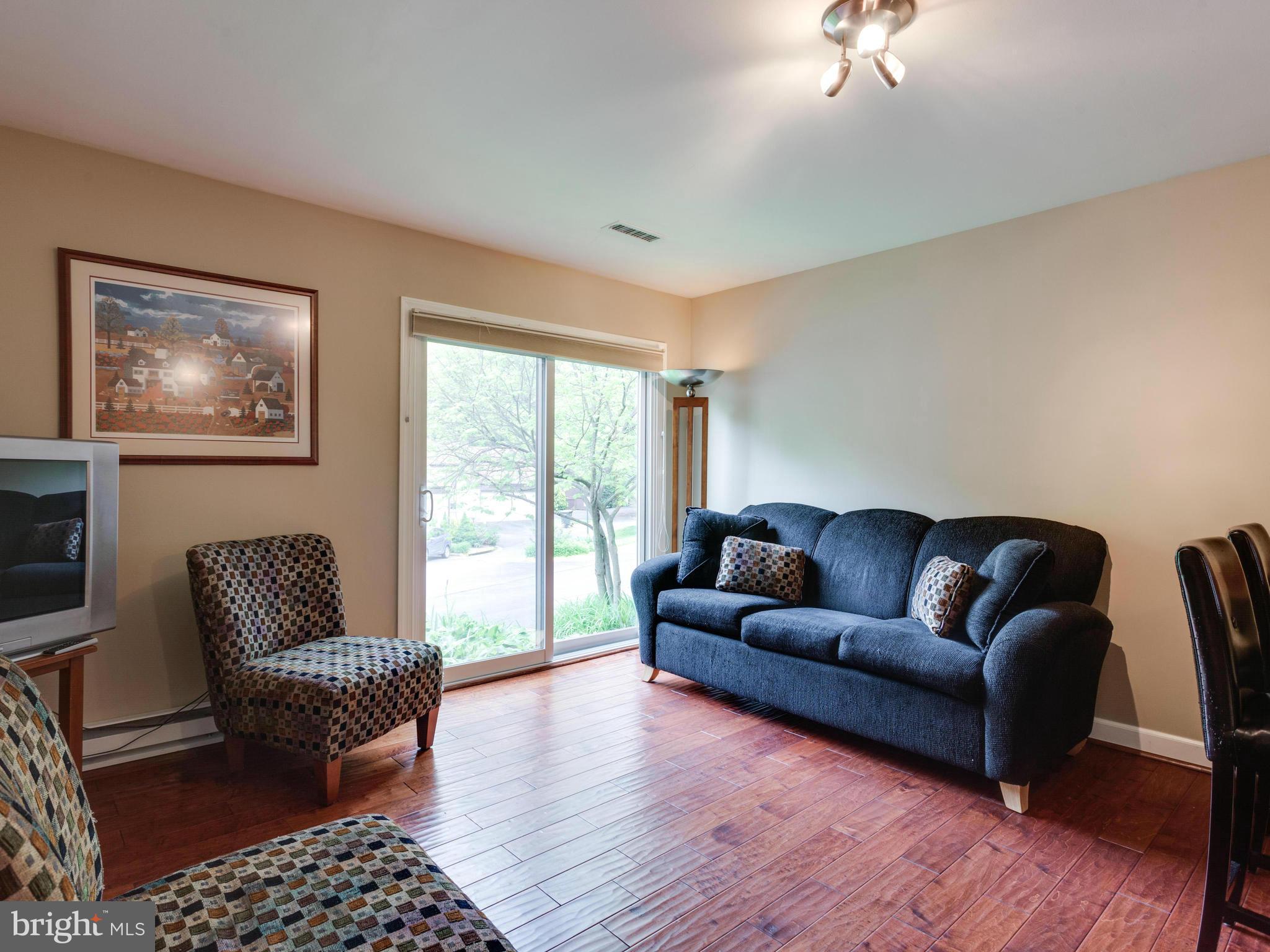 2357 Glade Bank Way Reston, VA 20191 - Photo 3 of 30 a living room with furniture and a rug