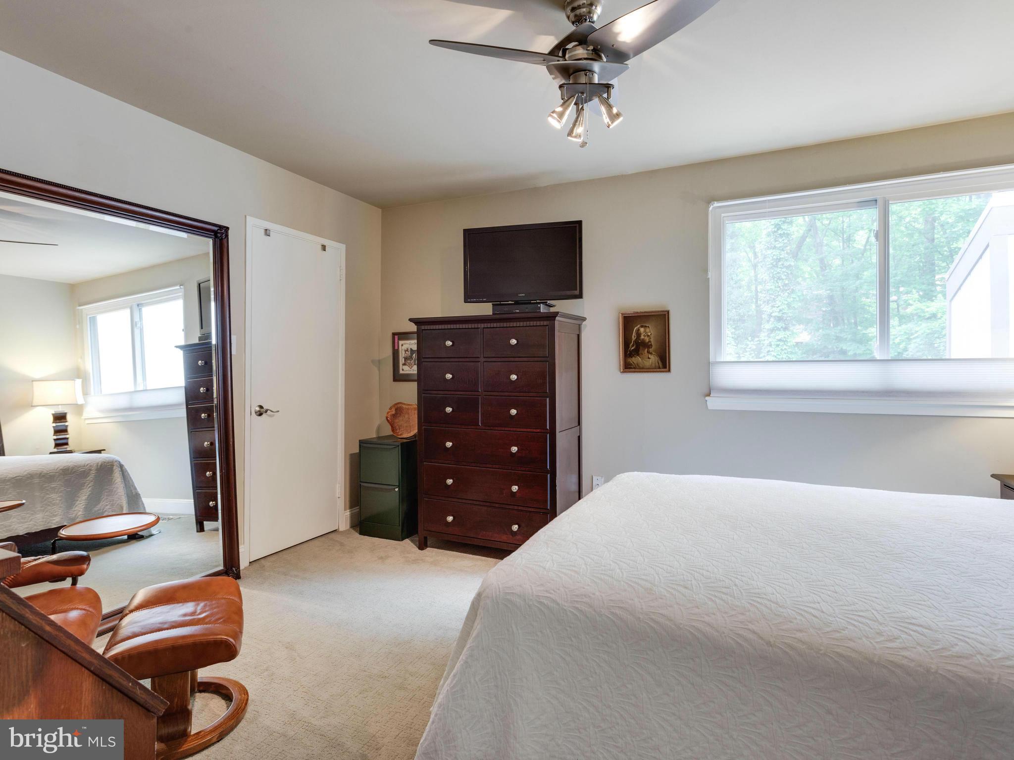 2357 Glade Bank Way Reston, VA 20191 - Photo 22 of 30 a bedroom with a bed and a television