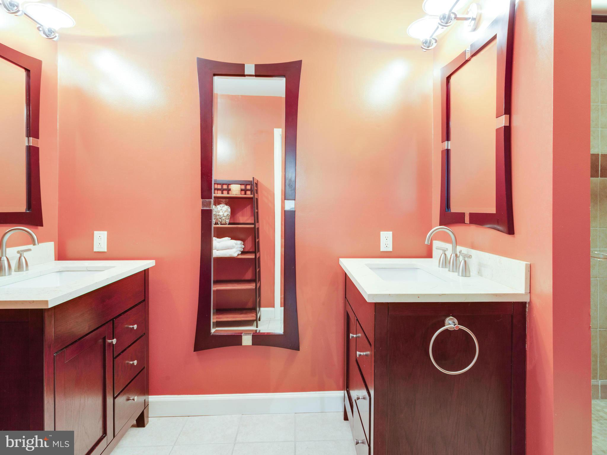 2357 Glade Bank Way Reston, VA 20191 - Photo 25 of 30 a bathroom with a granite countertop sink and a mirror