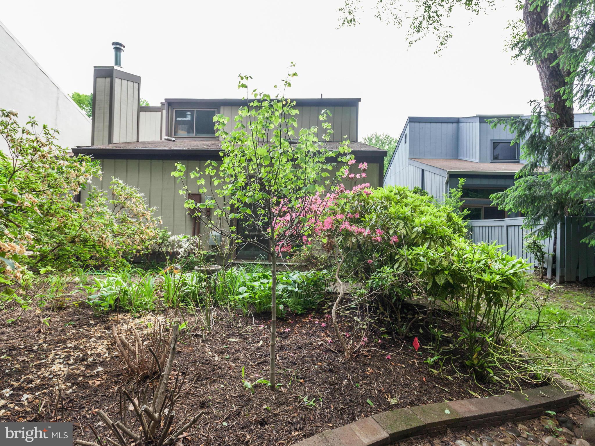 2357 Glade Bank Way Reston, VA 20191 - Photo 29 of 30 a view of a building with a garden and plants