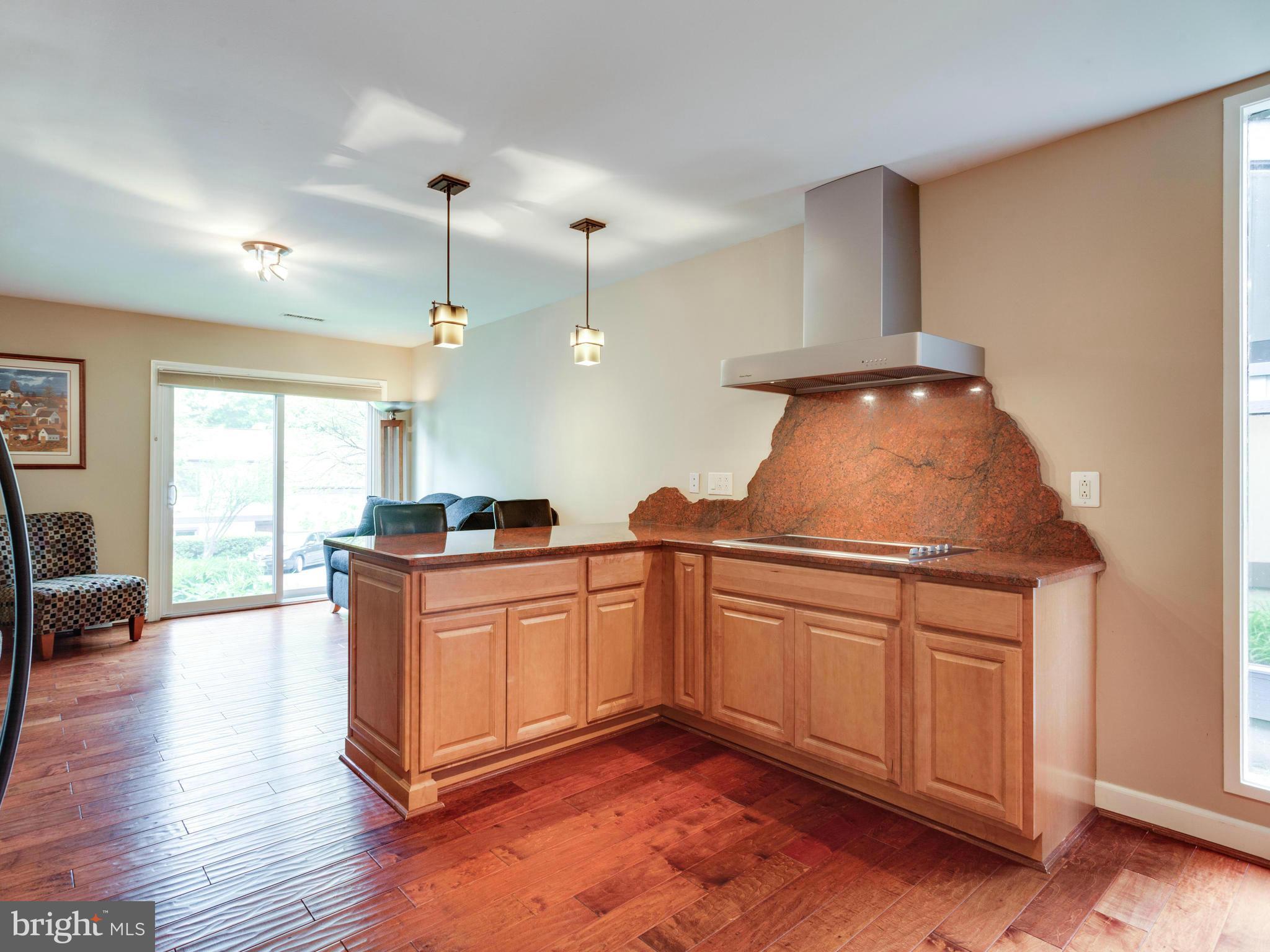 2357 Glade Bank Way Reston, VA 20191 - Photo 5 of 30 a kitchen with stainless steel appliances granite countertop a stove a sink dishwasher and a refrigerator with wooden floor