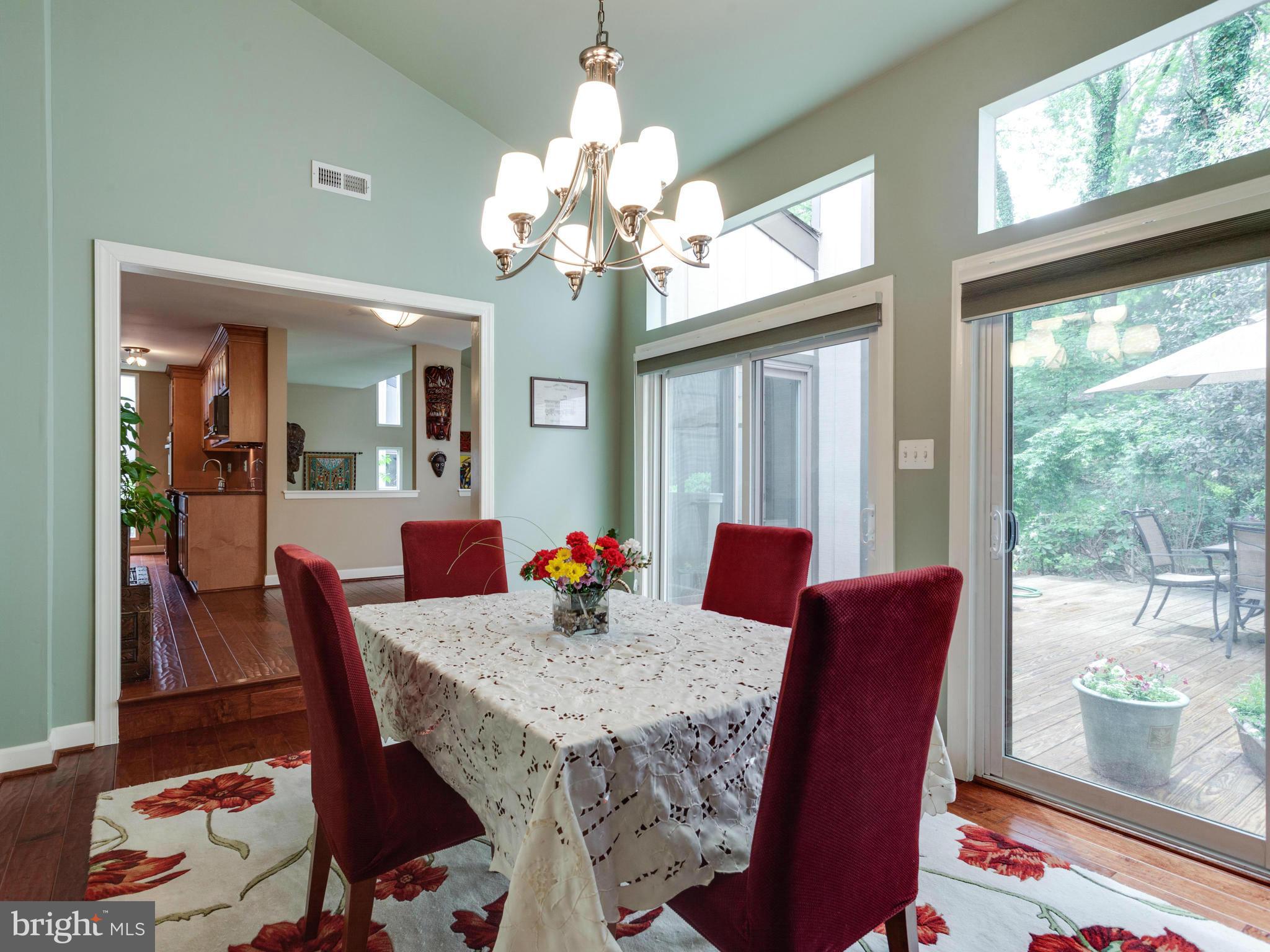 2357 Glade Bank Way Reston, VA 20191 - Photo 9 of 30 a view of a dining room with furniture window and wooden floor