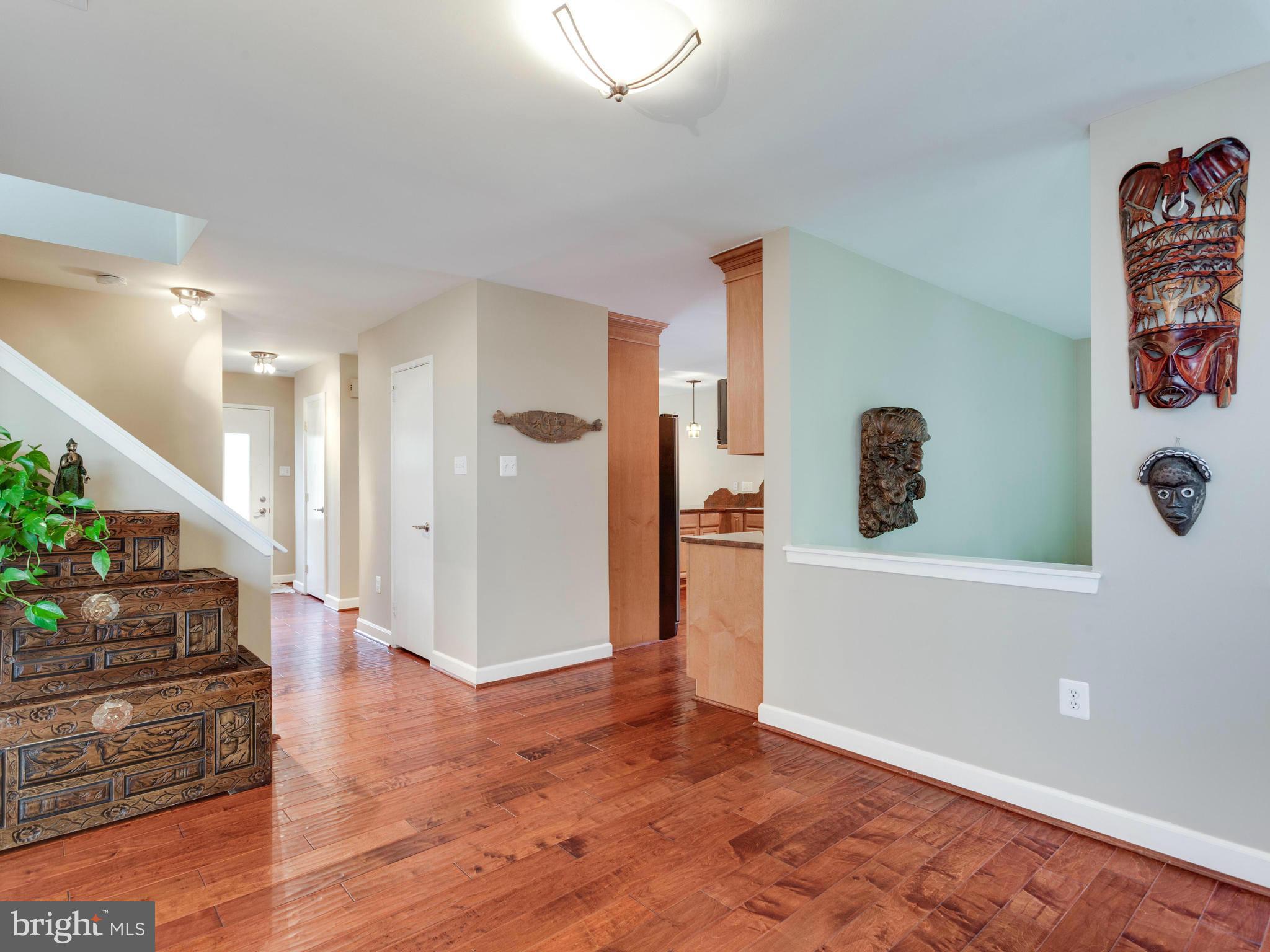 2357 Glade Bank Way Reston, VA 20191 - Photo 10 of 30 a view of a hallway view with wooden floor and entryway