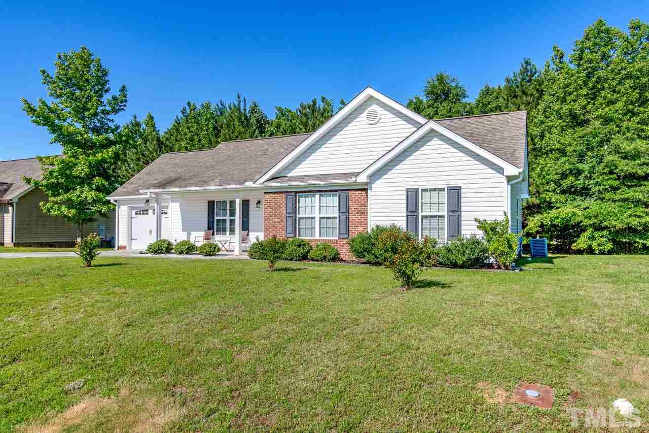 210 Orkney Road Stem, NC 27581 - Photo 2 of 26 a front view of a house with a yard