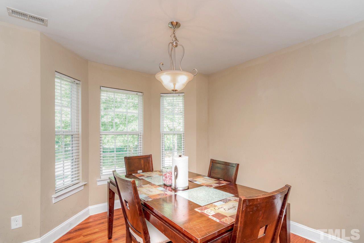 210 Orkney Road Stem, NC 27581 - Photo 11 of 26 a view of a dining room with furniture window and outside view