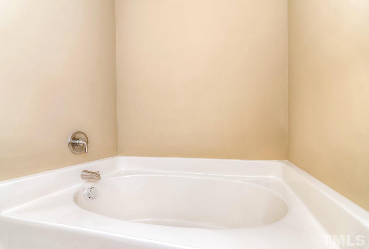210 Orkney Road Stem, NC 27581 - Photo 25 of 26 a bathroom with a bathtub