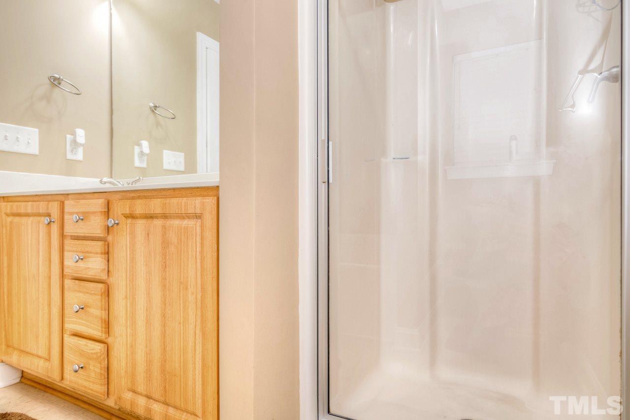 210 Orkney Road Stem, NC 27581 - Photo 26 of 26 a view of a bathroom with shower curtain and a window