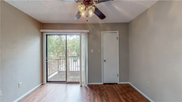 a view of room with wooden floor
