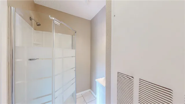 a bathroom with a shower and a toilet