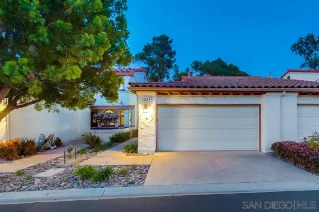 a view of a house with outdoor seating space