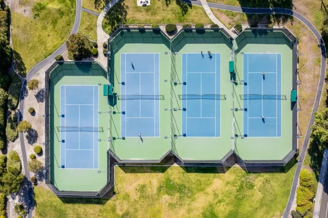 an aerial view of residential houses with outdoor space