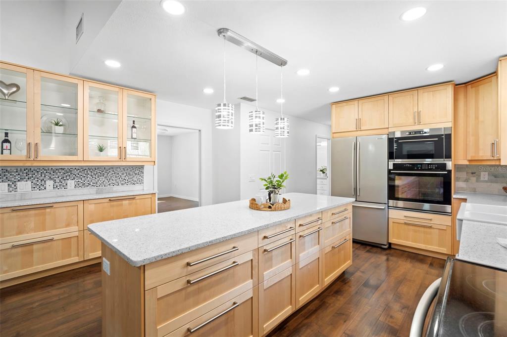 2053 Bond Road DeLand, FL 32720 - Photo 11 of 51 a kitchen with a sink refrigerator and microwave