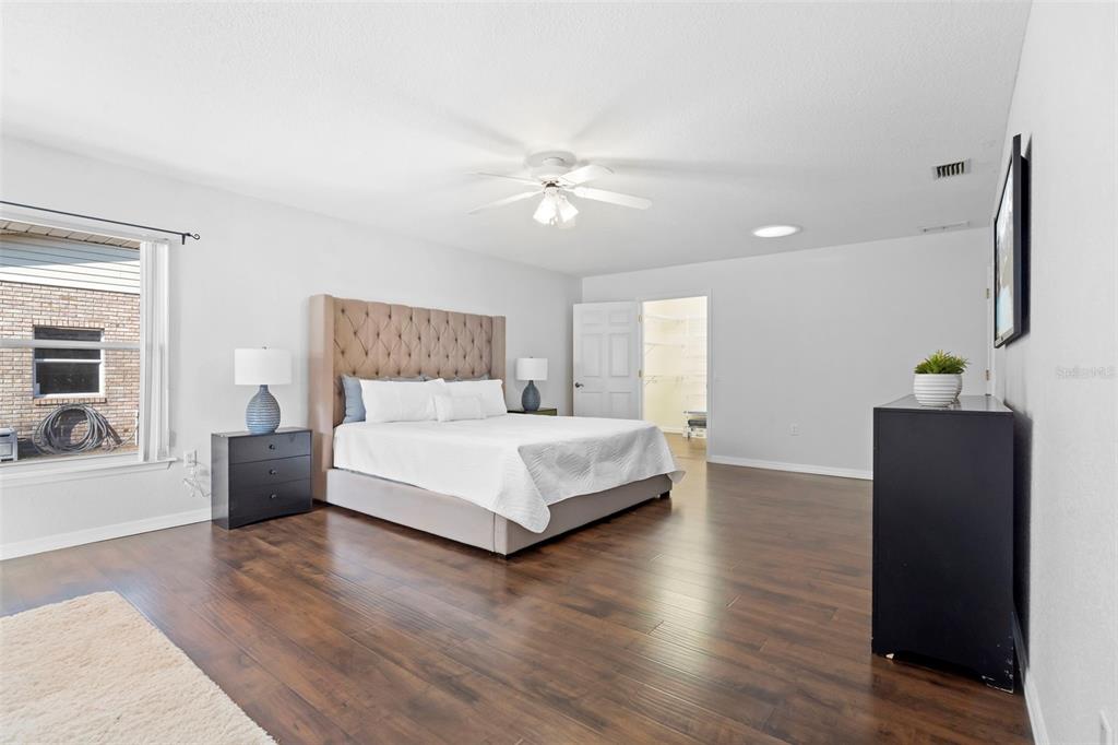 2053 Bond Road DeLand, FL 32720 - Photo 15 of 51 a bedroom with a bed and wooden floor