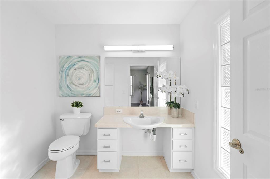 2053 Bond Road DeLand, FL 32720 - Photo 17 of 51 a bathroom with a toilet a sink and a mirror