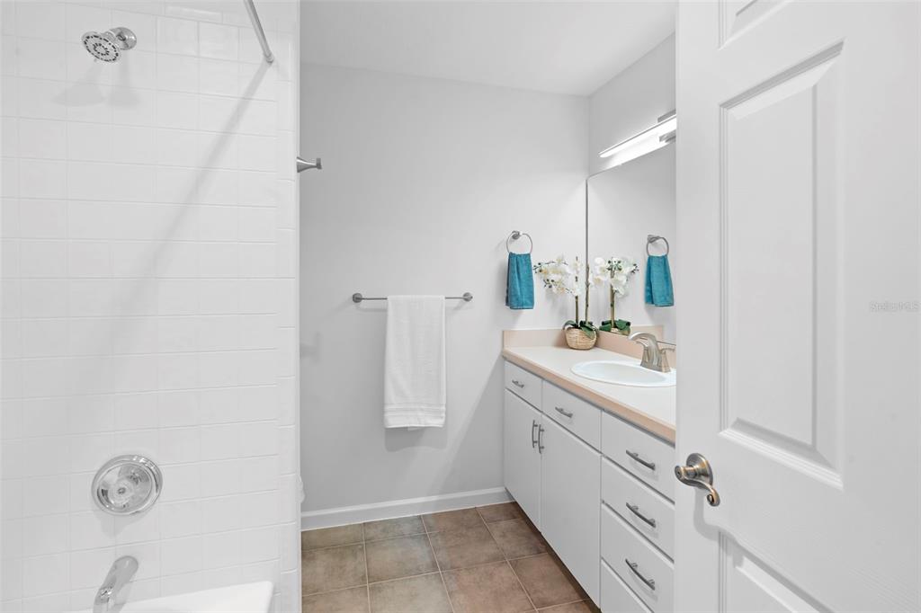 2053 Bond Road DeLand, FL 32720 - Photo 18 of 51 a bathroom with a double vanity sink and mirror