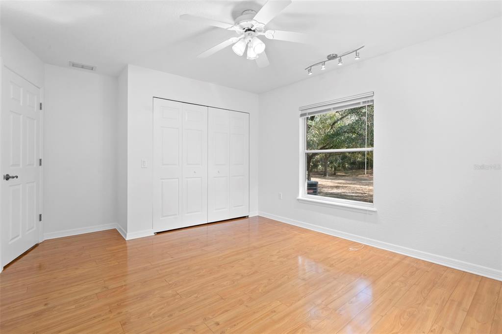 2053 Bond Road DeLand, FL 32720 - Photo 20 of 51 wooden floor in an empty room with a window