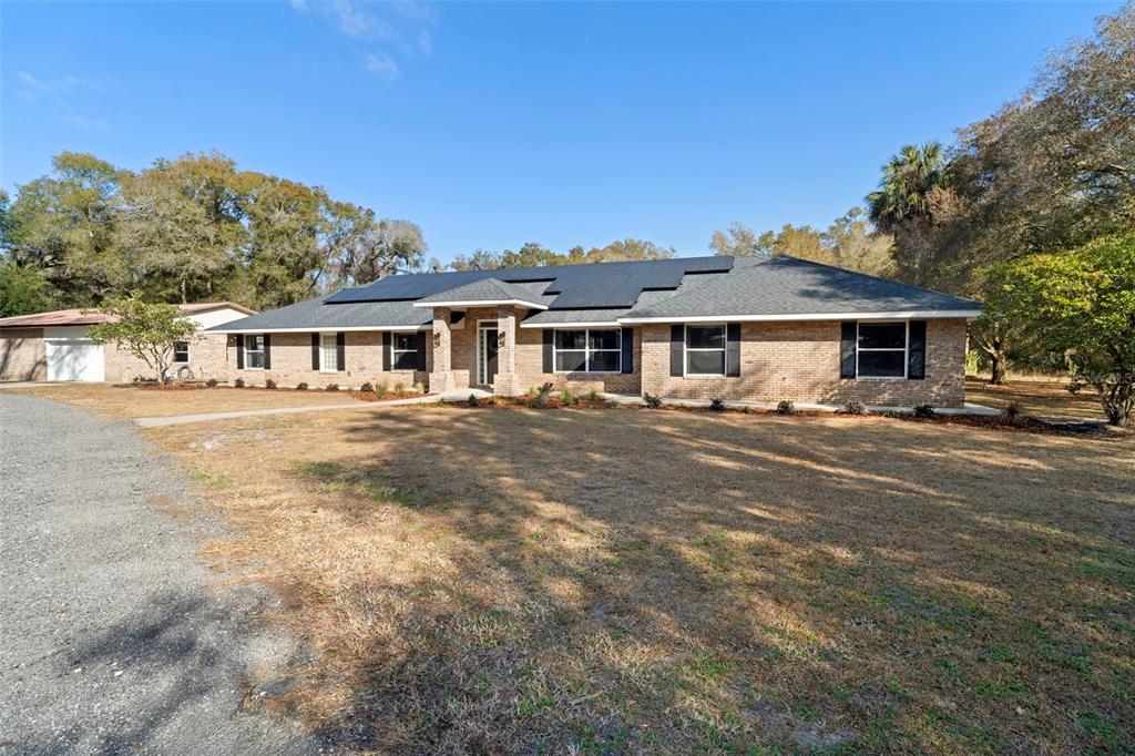 2053 Bond Road DeLand, FL 32720 - Photo 2 of 51 a front view of a house with a yard