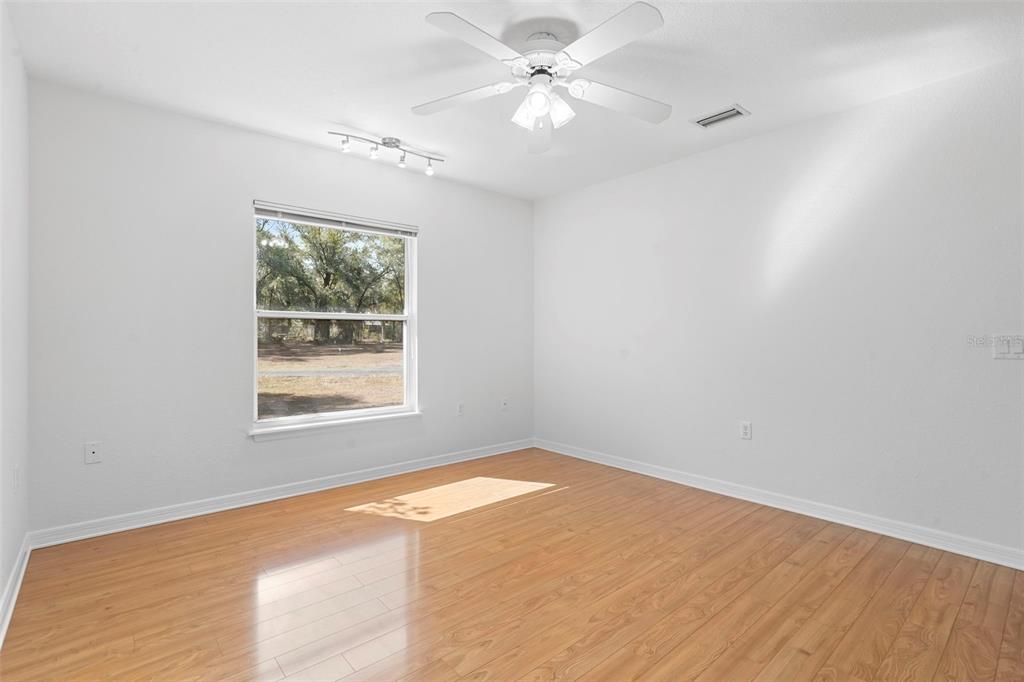 2053 Bond Road DeLand, FL 32720 - Photo 21 of 51 an empty room with a window and a fan