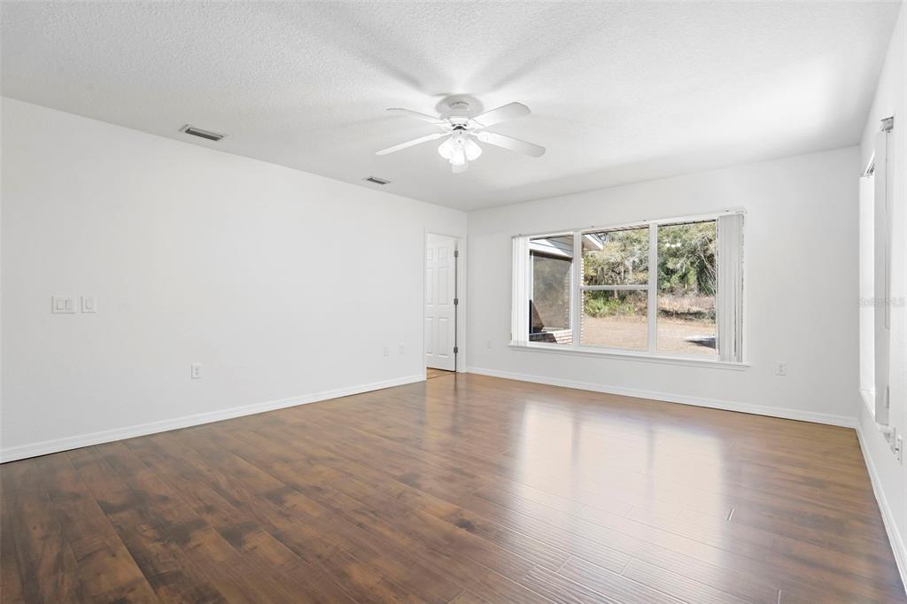2053 Bond Road DeLand, FL 32720 - Photo 25 of 51 wooden floor in an empty room with a window