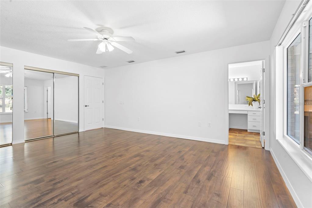 2053 Bond Road DeLand, FL 32720 - Photo 26 of 51 wooden floor in an empty room with a window