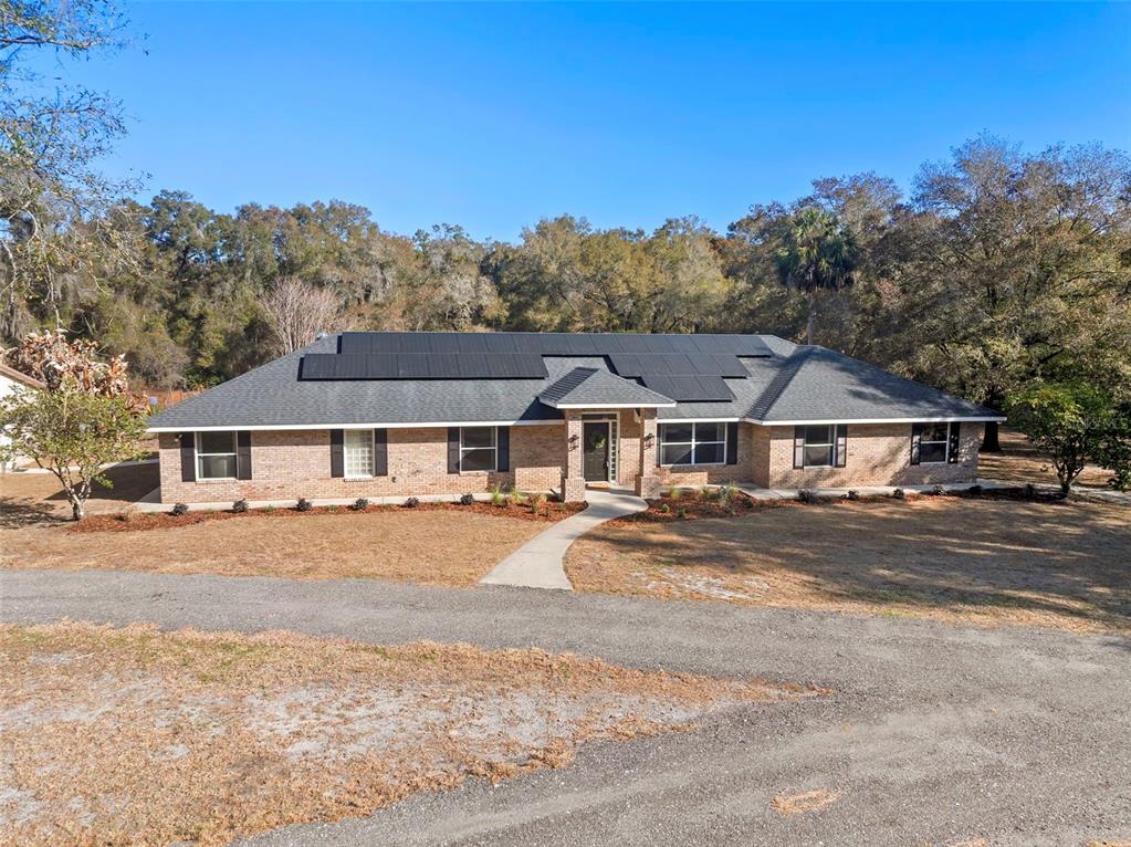 2053 Bond Road DeLand, FL 32720 - Photo 48 of 51 front view of a house with a dirt yard