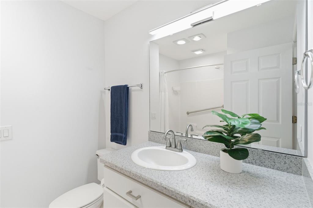 2053 Bond Road DeLand, FL 32720 - Photo 49 of 51 a bathroom with a sink a toilet and a mirror