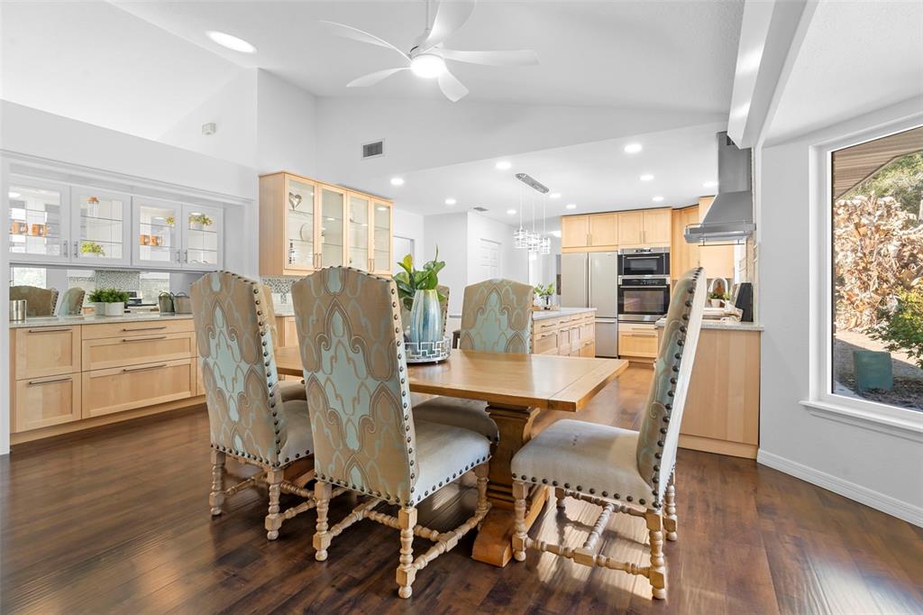 2053 Bond Road DeLand, FL 32720 - Photo 8 of 51 a view of a dining room with furniture and wooden floor