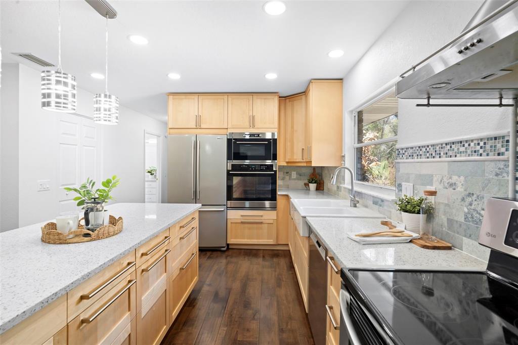 2053 Bond Road DeLand, FL 32720 - Photo 10 of 51 a kitchen with a sink stove and refrigerator