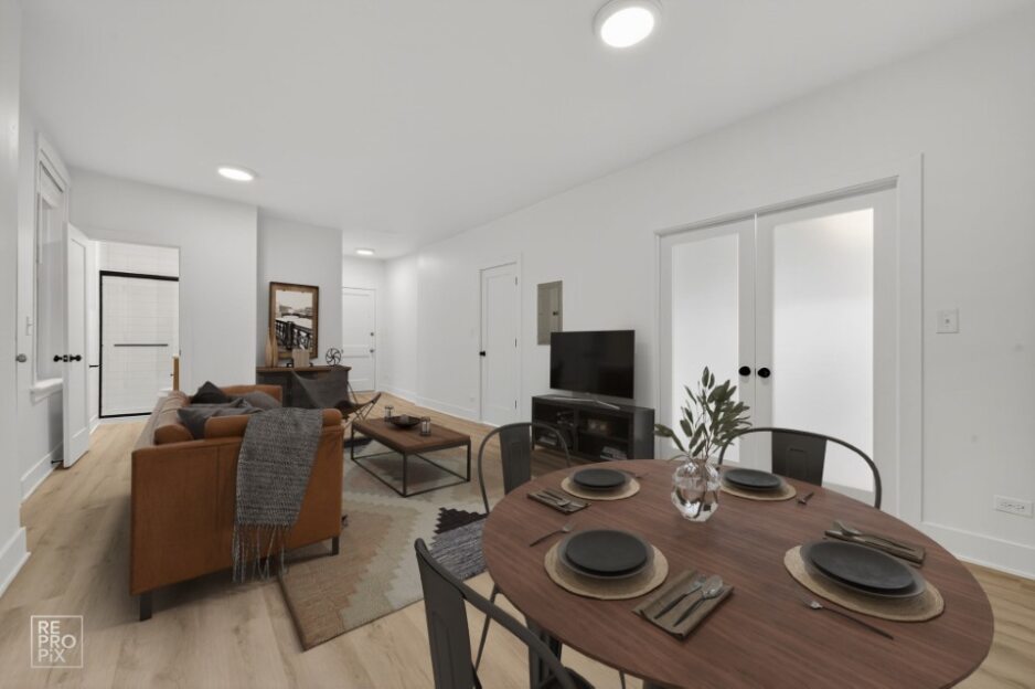 6977 North Bell Avenue, Unit 3 Chicago, IL 60645 - Photo 5 of 15 a living room with furniture and a flat screen tv