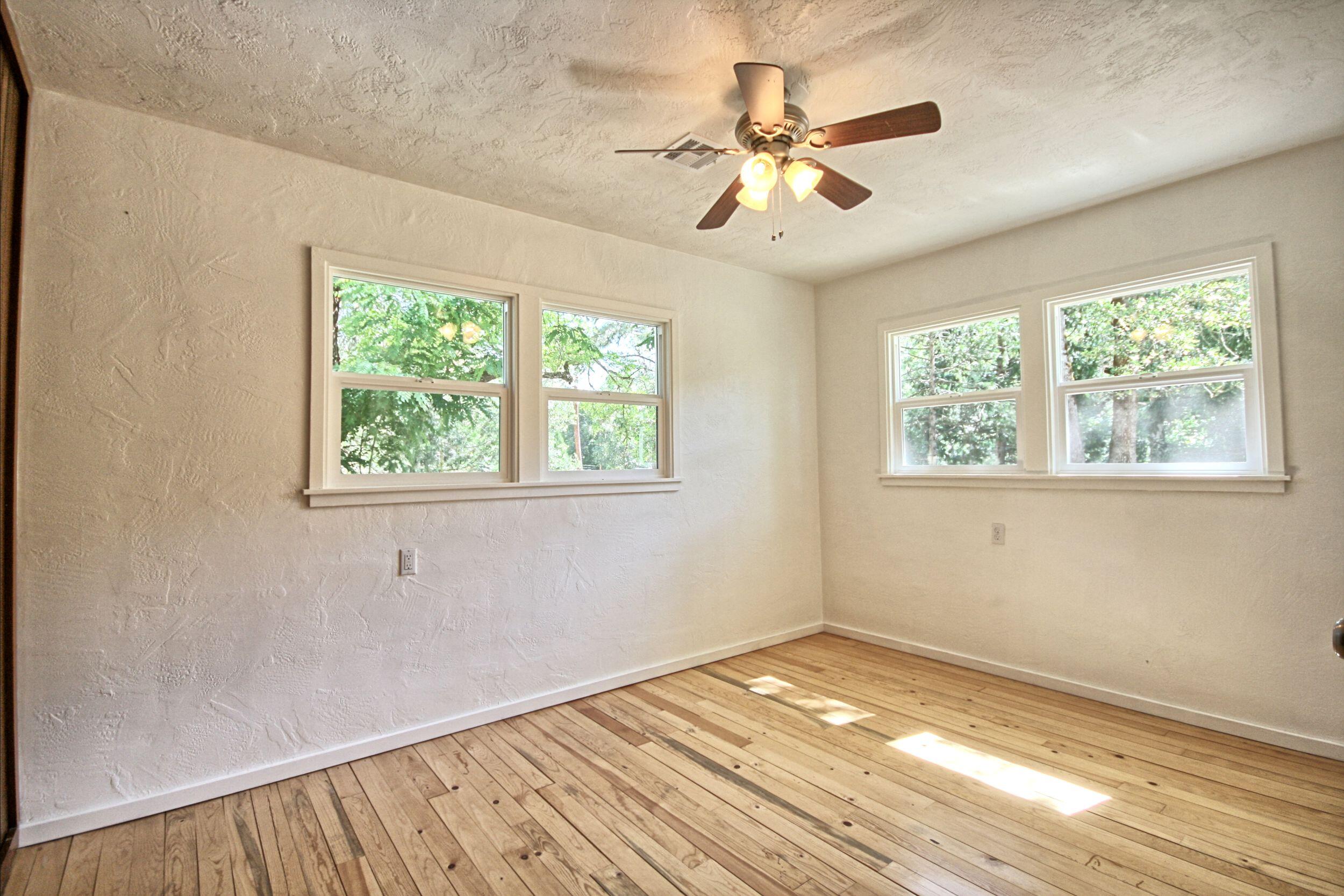 199 Powell Creek Road Williams, OR 97544 - Photo 30 of 57 a view of a room with wooden floor and a window