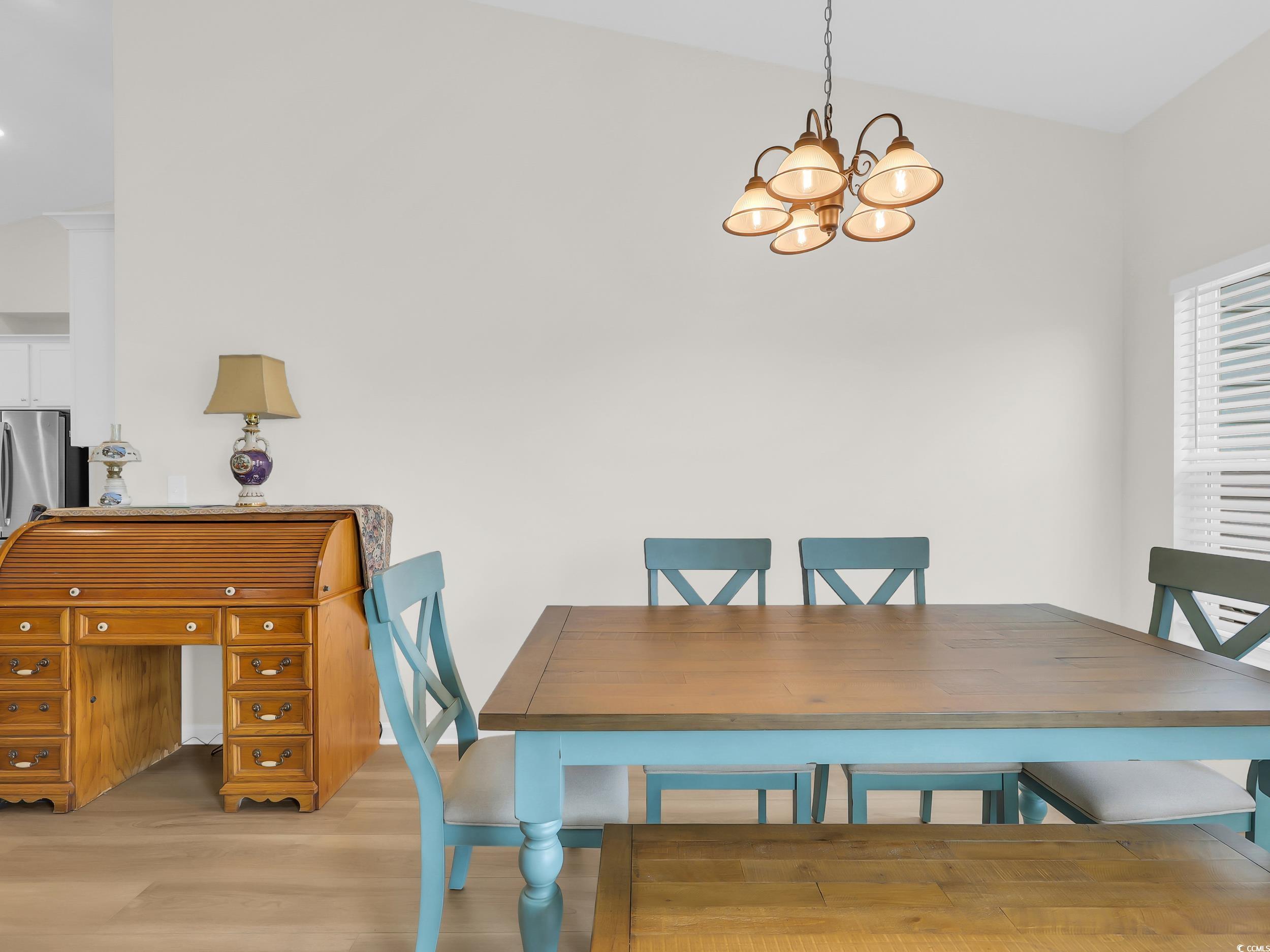 322 Augusta Grn Way Myrtle Beach, SC 29579 - Photo 13 of 34 Dining space with light wood-type flooring and a chandelier