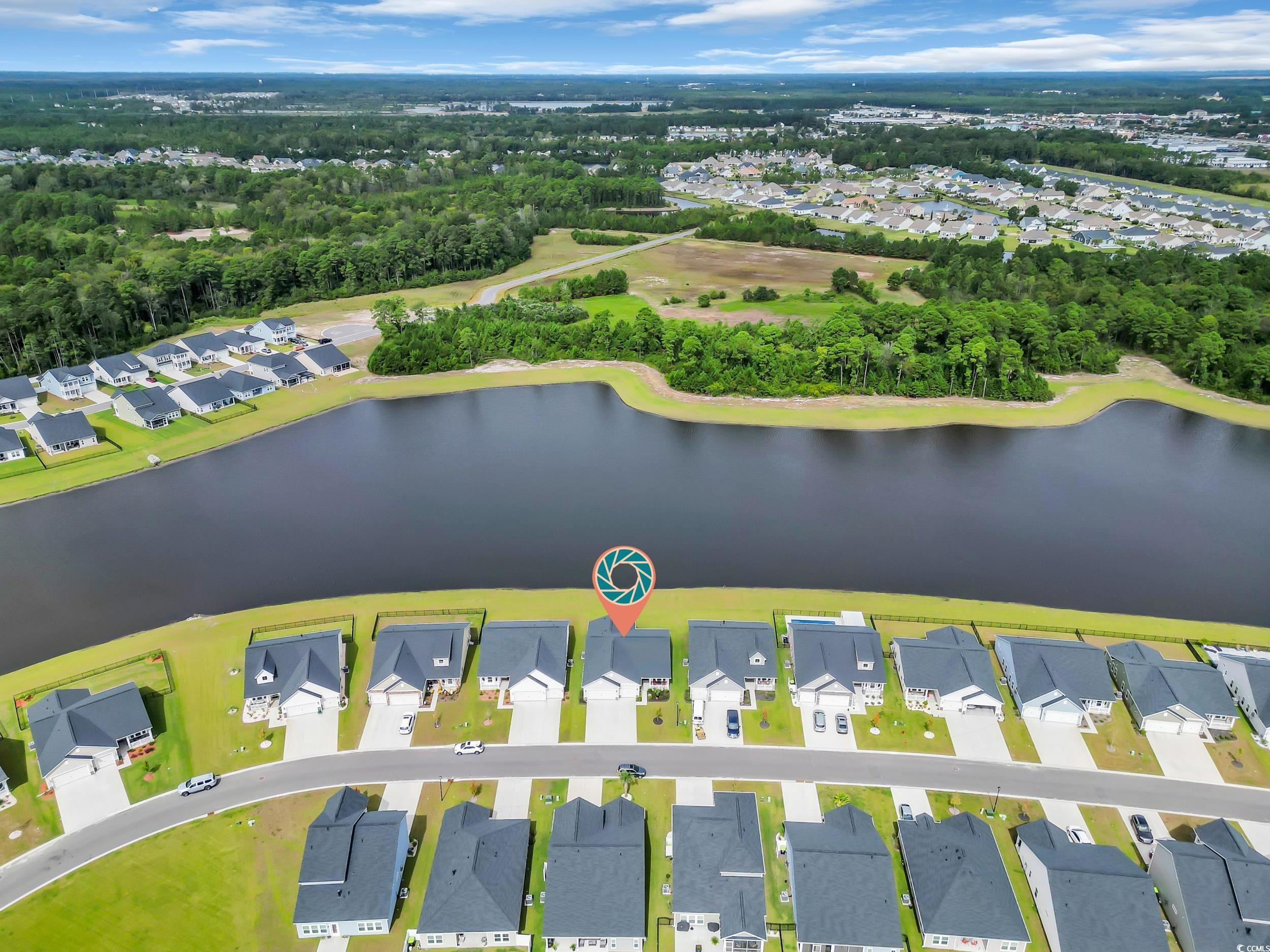 322 Augusta Grn Way Myrtle Beach, SC 29579 - Photo 3 of 34 Aerial perspective of suburban area with a nearby body of water