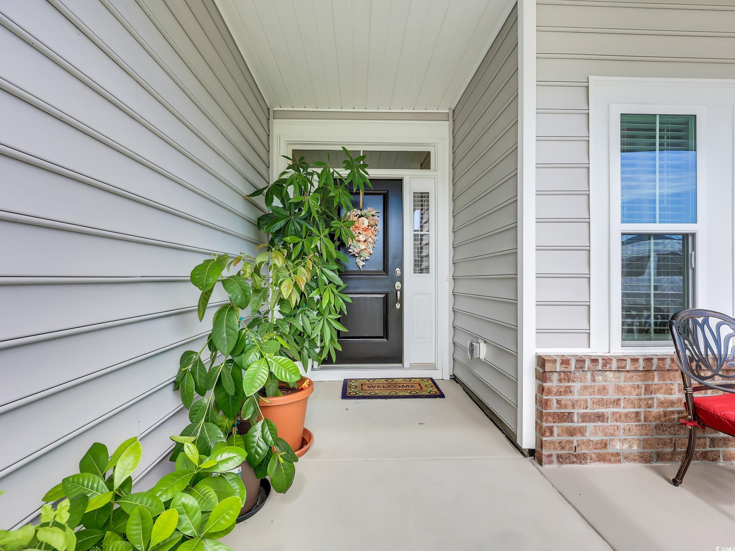 322 Augusta Grn Way Myrtle Beach, SC 29579 - Photo 5 of 34 Entrance to property with a porch